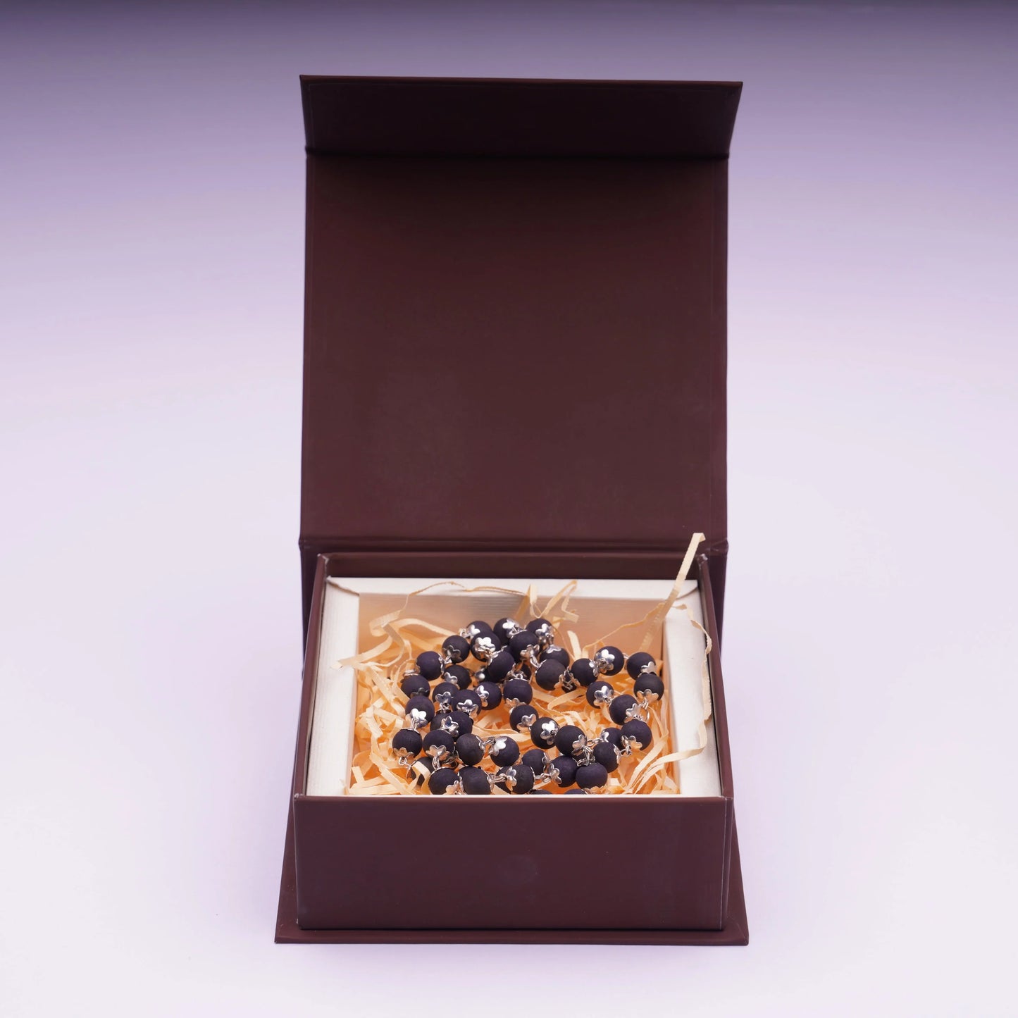 Karungali mala with black beads and silver plating in a gift box
