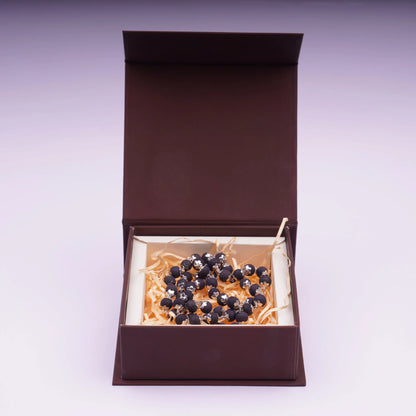 Karungali mala with black beads and silver plating in a gift box