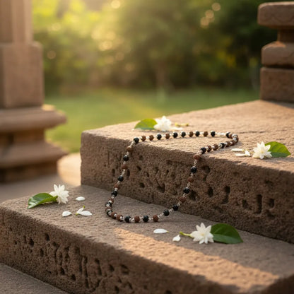  Dwanda mala alternating Rudraksha and Karungali ebony beads on temple steps
