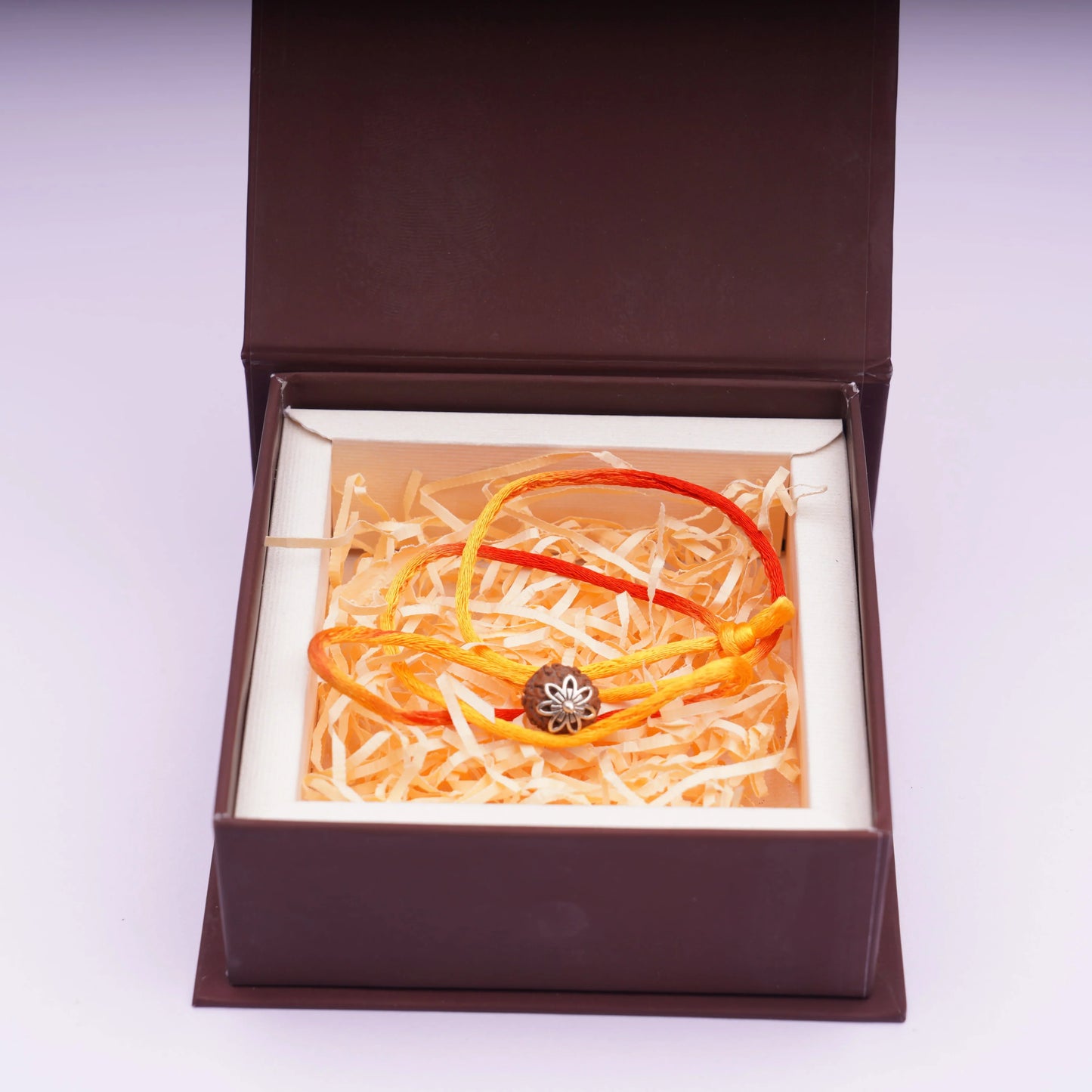 7 Mukhi Rudraksha pendant with orange-yellow thread in a gift box